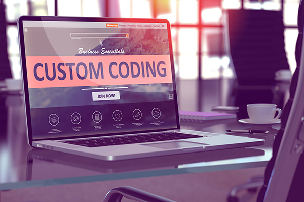 Custom Coding Concept on Laptop Screen.